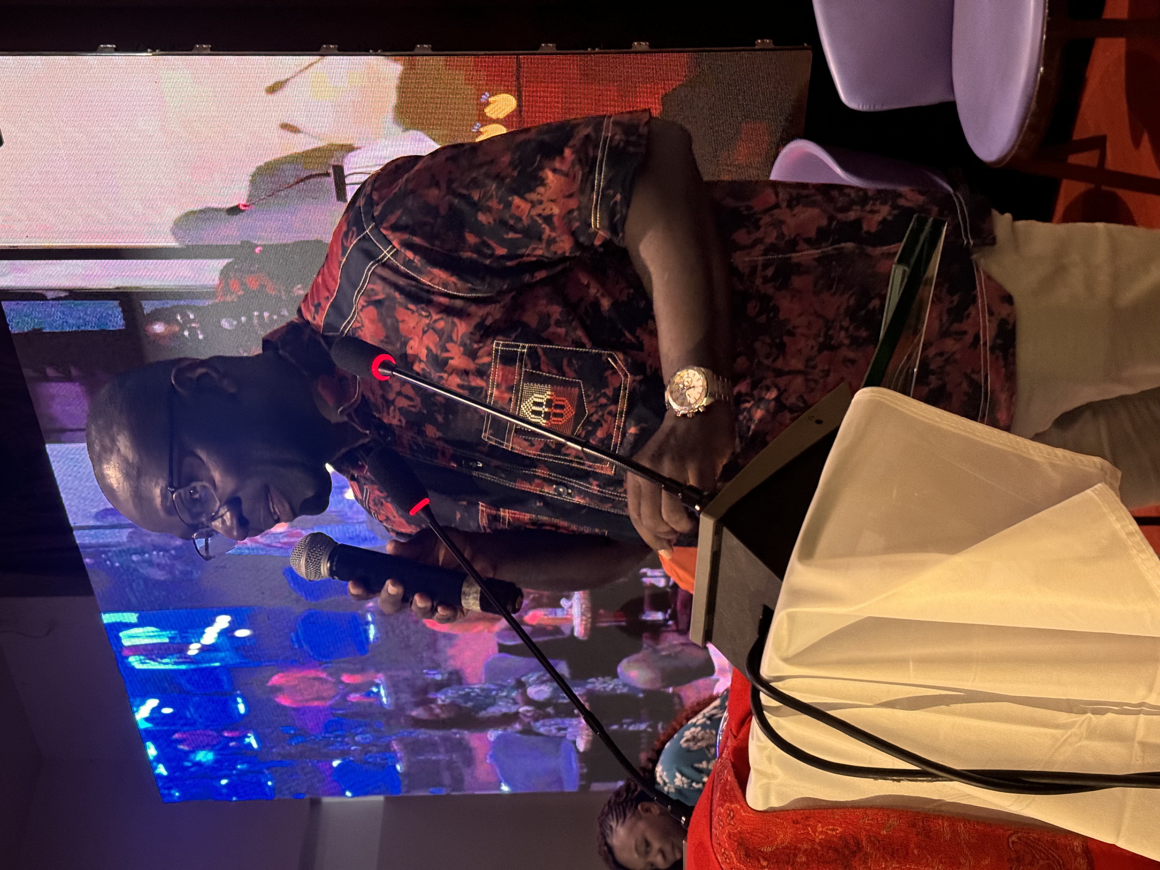 A photo of Dr Ali Ouattara speaking at an event.